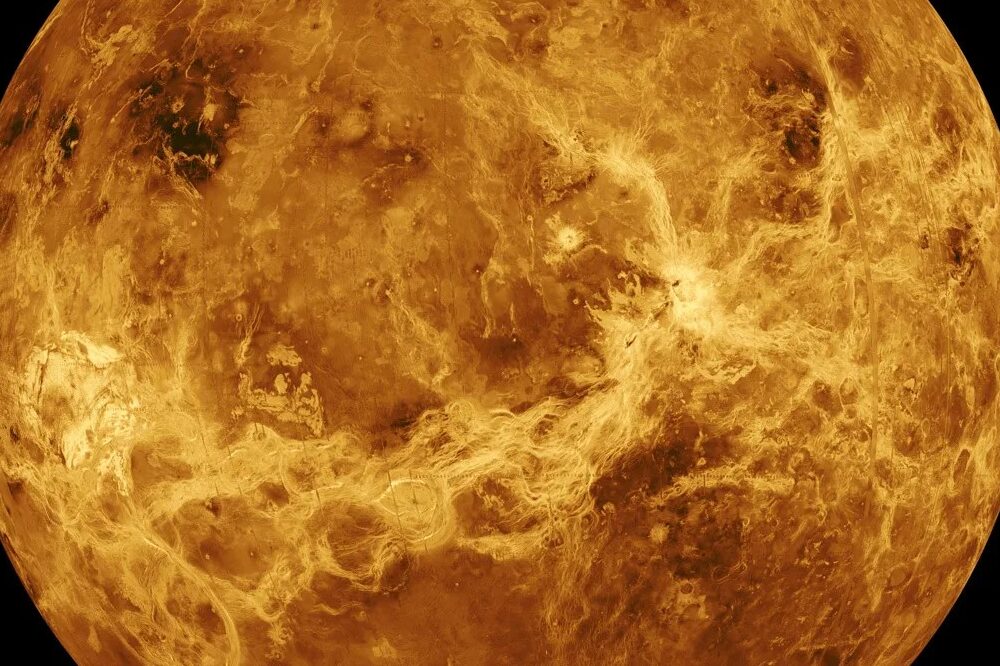 An image of Venus showcasing volcanic flows and various terrains